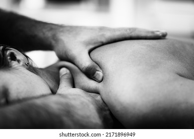 Close Up Image Of Physical Therapist Massaging Female Client’s Shoulder.