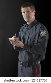 Close up image of police officer against black background