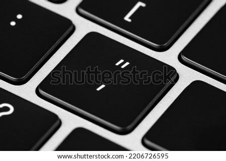 Close up image of a "quotation mark" and "apostrophe" key on a keyboard