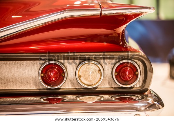 Close up\
image of the rear lights of a vintage\
car.