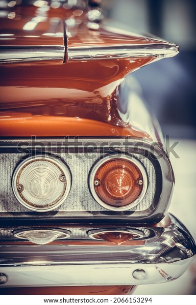 Close up\
image of the rear lights of a vintage\
car.