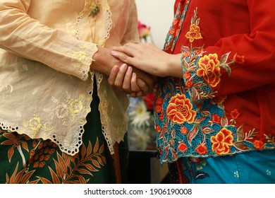 Close Up Image Of Southeast Asian Woman In Traditional Malay Batik Kebaya Dress. 