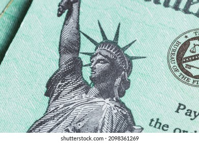 A Close Up Image Of The Statue Of Liberty On An IRS Stimulus Refund Check