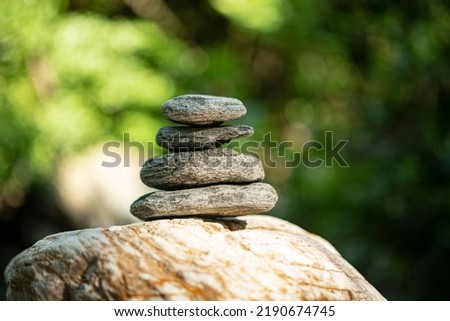 Close up image of stone balancing in nature