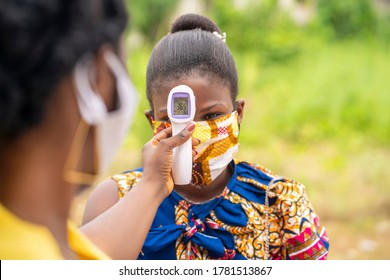 Close Up Image Of Thermometer Gun Screen With The Temperature Digits-image Of Health Official Checking Temperature During The Covid-19 Pandemic In Africa