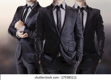 Close Up Image Of Three Business Men In Black Suit