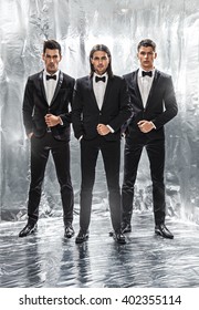 Close Up Image Of Three Business Men In Black Suit,silver Background