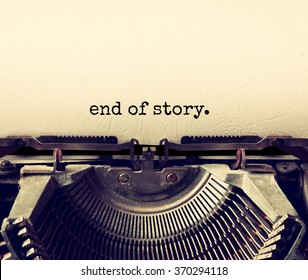 close up image of typewriter with paper sheet and the phrase: end of story. copy space for your text. retro filtered
