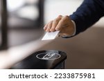 Close up image unrecognizable businessman hand using plastic pass card entering or leaving office modern workspace. Gateway and electronic card reader for area security, end or start of working day