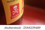 close up image of a warning sign on a bottle label with poison label, dangerous liquid, harmful to consume, poison warning