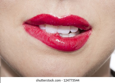 Close Up Image Of Woman Biting Her Lips