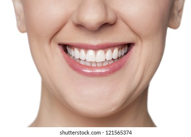 Close Up Image Of Woman With Toothy Smile Against White Background