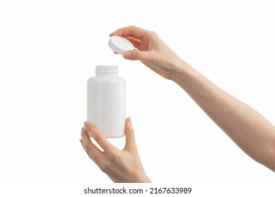 A Close Up Image Of Woman's Hand Holding Medical Bottle, Isolated On White Background