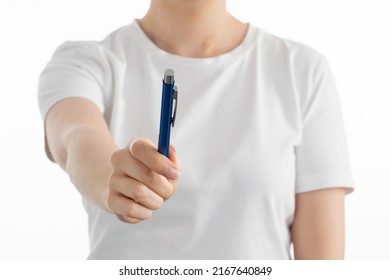 A Close Up Image Of Woman's Hand Holding Blue Pen On White Background