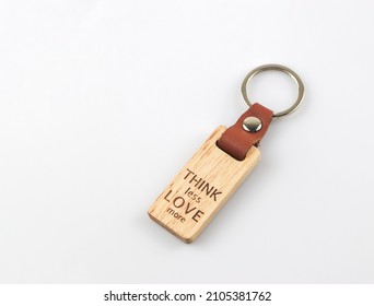 Close up image of wooden keyring with word 