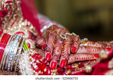 Close up of a Indian bride's hands.
A close up shot of a bride's hands, which is decorated with mehendi, during a traditional Indian style wedding in New Delhi. 