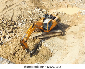 Close up  of industrial excavator working on construction site. Selective focus and crop fragment