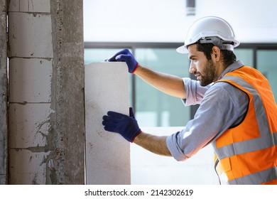 Close up industrial masonry walls, install bricks on construction sites. - Shutterstock ID 2142302619