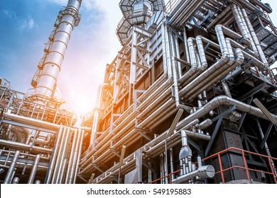 Close up Industrial view at oil refinery plant form industry zone with sunrise and cloudy sky - Shutterstock ID 549195883