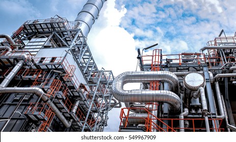 Close Up Industrial View At Oil Refinery Plant Form Industry Zone With Sunrise And Cloudy Sky