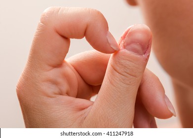 Close Up Of Injured Female Finger After Biting Nails