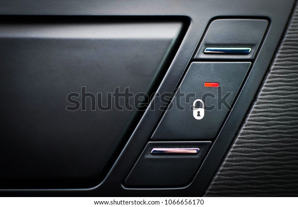 Close up inside car door\
lock button