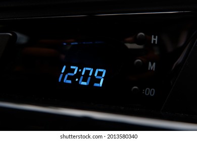 Close up interior dashboard view of the car system. Digital clock

