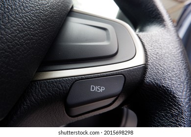 Close up interior dashboard view of the car system.  Steering wheel