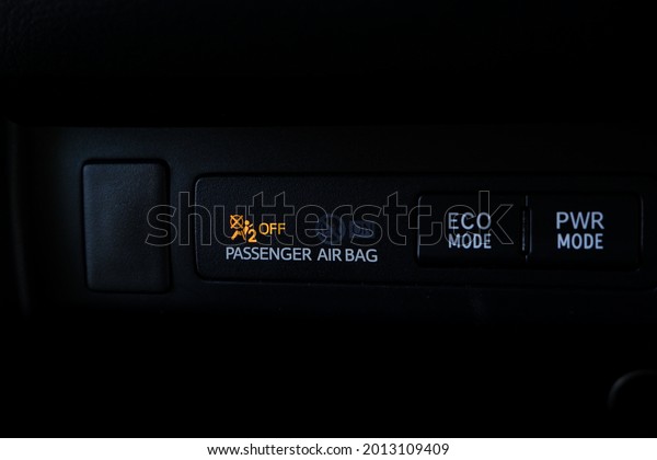 Close up interior\
dashboard view of the car system. Passenger airbag system. Eco\
Mode. Power Mode.\
\
