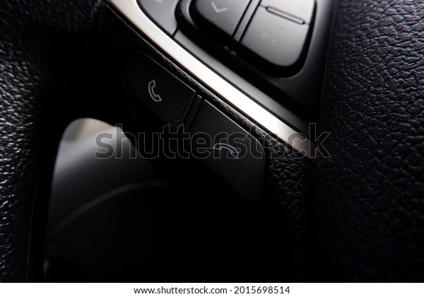 Close up interior dashboard view of the car system.\
Steering wheel 