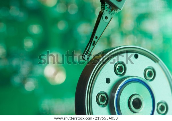 Close up interior of hard\
disk. Open cover hard disk in computer or server. Technology\
background. Selective focus to hdd read - write head. Data Backup\
concept. 