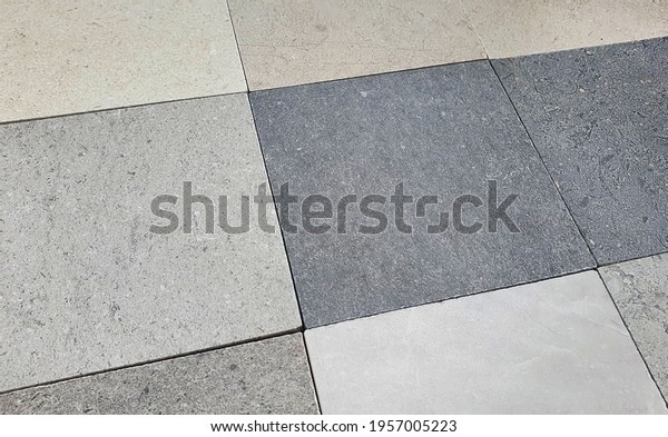 close up interior stone texture tile samples in
grey ,beige ,ivory ,bone color tone used for wc or bathroom wall
and floor finishing. interior tile samples background for mood and
tone board.