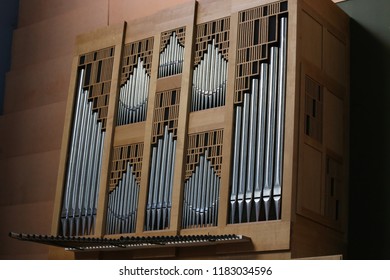 Close up interior view of the iberian organ located in saints-françois church, in Montpellier city, southern France. September, 16, 2018. Classical wooden musical instrument with vertical iron pipes.