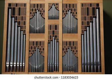 Close up interior view of the iberian organ located in saints-françois church, in Montpellier city, southern France. September, 16, 2018. Classical wooden musical instrument with vertical iron pipes.