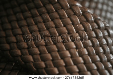 close up of interwoven brown leather texture                               