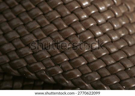 close up of interwoven brown leather texture                                    