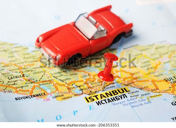 Close up of  Istanbul ,Turkey  map with red pin\
and a car   - Travel\
concept