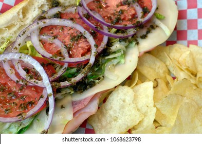 Close Up Of Italian Cold Cut Sub With Chips