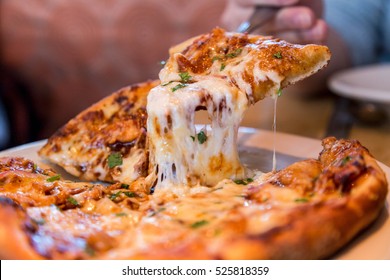 Close up Italian pizza about cheese it stick. Selective focus. - Powered by Shutterstock