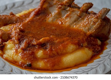 Close Up Of Italian Polenta With Pork Ribs In Tomatoes Sauce.