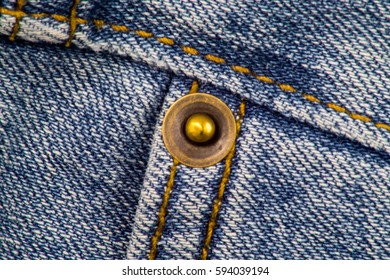 Close Up Of A Jeans With Rivet And Stitchings