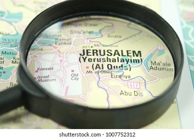 Close up of Jerusalem under a magnifying glass on a map