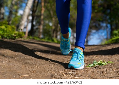 Close Up Jogger Woman Legs Walking On The Trail In The Forest