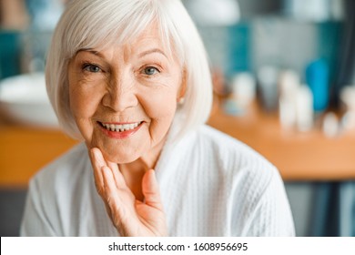 Close up of joyful elderly lady touching her face stock photo - Shutterstock ID 1608956695