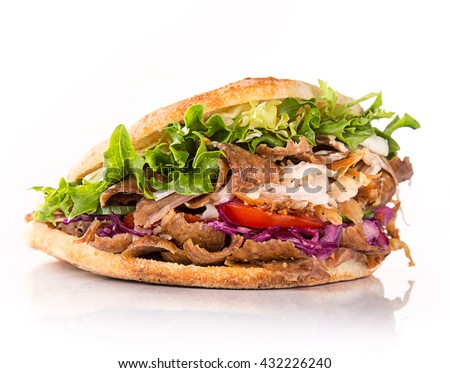 close up of kebab sandwich on white background