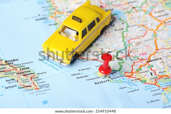 Close up of Kerkyra island , Greece map and taxi\
toy - Travel concept