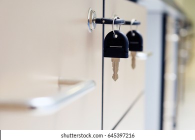 Close Up Key Locked On Filing Cabinet Drawer Desk Furniture In Office Building