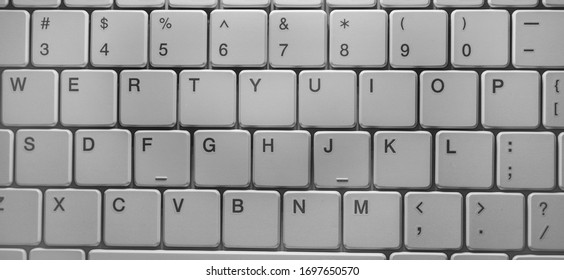 Close up of keyboard of a modern laptop - Shutterstock ID 1697650570