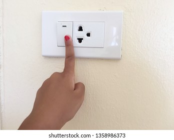 Close Up Finger’s Kid Is Turning On Or Turning Off The Light-switch.