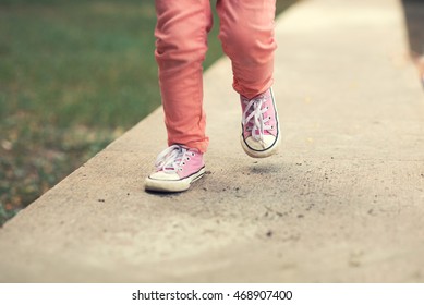 Close Up Of Kids Sneakers Walking On Street